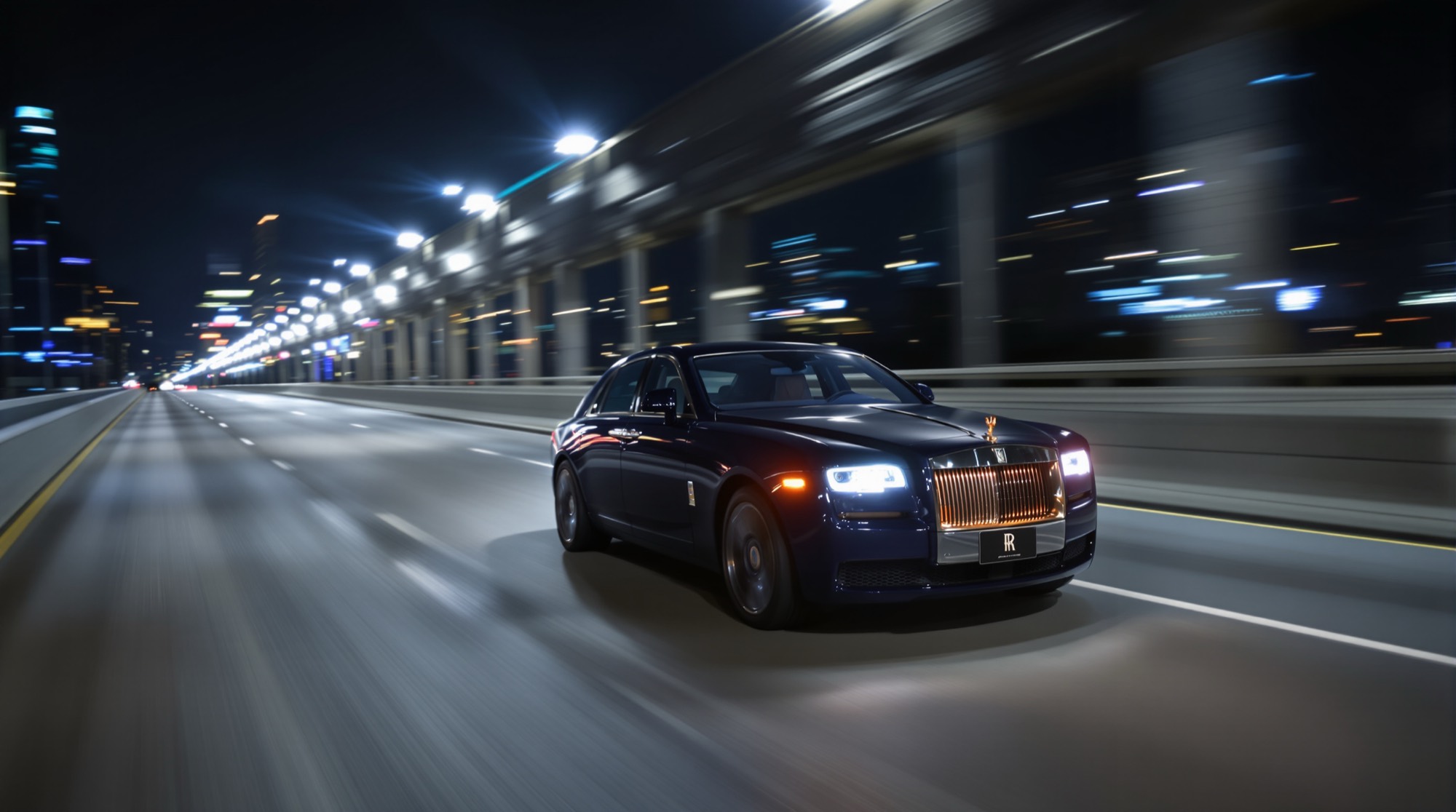 Navy Rolls-Royce Ghost on a Dallas highway at night